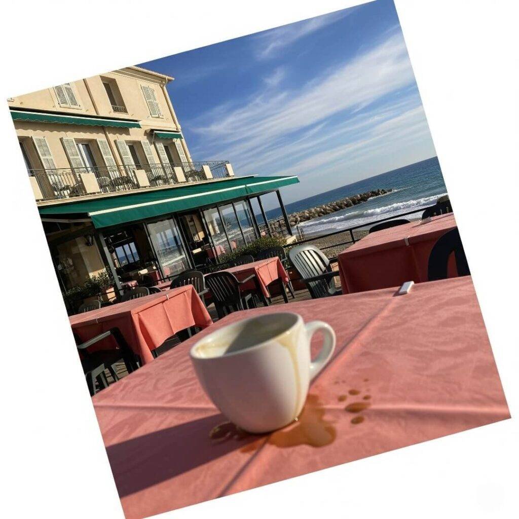Half-spilled coffee cup on a table at a French cafe.